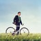 Business Man Pushing Bike Outdoors Concept