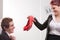 Business man receiving lovely red high heels shoes