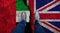 Business man stands on cracked flag of UK and UAE. Political concept