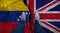 Business man stands on cracked flag of UK and Venezuela. Political concept