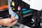 Business man or technician is checking and changing the printer equipment cartridges tone of laser jet multi function printer in