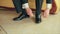 Business Man Tying Shoe Laces on the Floor Groom