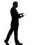 Business man walking touchscreen digital tablet silhouette