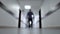 Business man walks down the corridor. Blurred background. Bottom view, perspective. 4K.