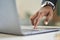 Business man wearing suit typing finger using laptop computer. Close up