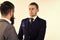 Business meeting. Men in classic suits, businessmen, business partners meeting, white background, isolated. Businessmen