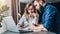 Business meeting. Teamwork. Businesswoman and businessman sitting at table in front of laptop. Online education