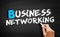 Business networking text on blackboard