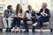 Business never looked brighter. Full length shot of a group of businesspeople brainstorming together in an office.