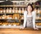 Business owner with bakery shop background