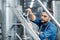 Business owner and brewery employee working in factory. Modern drink production in plant