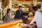 Business partners or colleagues doing check in at the hotel. Young couple and receptionist at counter in hotel