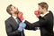 Business partners competitors fight with boxing gloves in formalwear isolated on white, competition