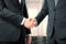 Business partners shake their hands in office