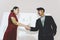 Business partners shaking hands after concluding a business presentation finished. Business man and woman standing in front of