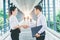 Business partnership handshaking after striking deal outdoors at