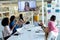 Business people applauding during video conference at conference room in a modern office