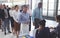 Business people checking in at conference registration table