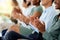 Business people clapping hands at corporate seminar in a modern, creative and company building. Closeup of happy