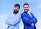 Business people concept. Bearded business people posing confidently. Business men stand blue sky background. Perfect in