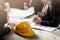 Business people with construction blueprint