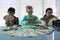 Business people counting money at desk