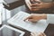 Business people discussing contract signing deal while sitting at the glass table in office, closeup. Partners or