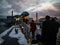 Business People Exit a Ferry In the Evening