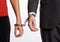 Business people handcuffed together