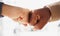 Business people, hands and fist bump in partnership, unity or trust for deal or agreement against blurred background