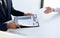 Business people hold resume documents, interviews for the work experience of young men applying as financial accountants for the c