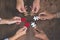 Business people Holding Jigsaw Puzzle, group of business people using a jigsaw puzzle to demonstrate the need to work in the same