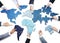 Business People with Jigsaw Forming World Map