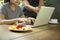 Business people man and woman team work with laptop with fresh f