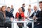 Business people during a meeting sitting around a glass table