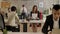 Business people of mixed ethnicity working in office, asian woman giving to caucasian woman documents, woman looking at