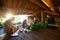 Business People Preparing Meal In Shed At Forest