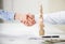 Business people shake hands near built wooden tower