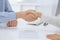 Business people shaking hands at meeting or negotiation after contract discussing. Businessman and woman handshake at office while