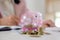 Business people sheltering coins and piggy bank at desk. saving