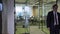 Business people work in office with glass partitions.