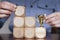 Business person arranging large wooden blocks with a winning trophy. Business success