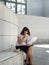 Business person eating lunch outside office