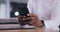 Business person, hands and phone at desk in office for social network, mobile chat and contact in company. Closeup