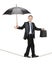 A business person holding an umbrella