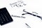 Business plan words near glasses, calculator and pen, business concept
