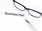 Business plan words near glasses and pen, business concept