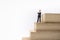 Business, Planning, Succession and Management Concept. Close up of businessman miniature figure standing and thinking on Stack of
