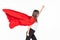 Business, power, success, achievement and people concept. Young smiling businesswoman in red superhero cape holding raised fists