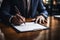 Business professional signing contract documents, close up on hands